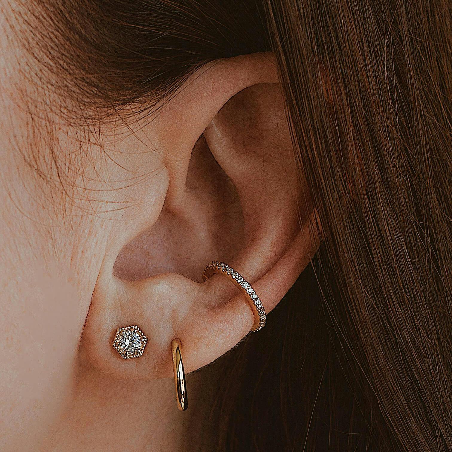 Classic Huggie Hoops in Titanium on model (Gold)